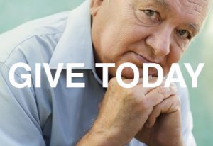 give today older person with a collared shirt and hands folded under chin