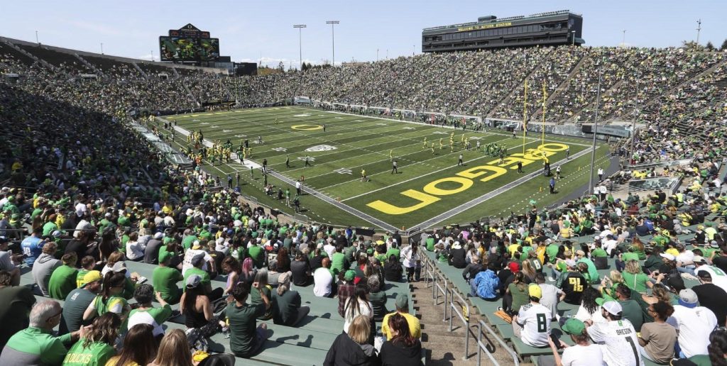 panoramic view of Autzen stadium filled with fans on a sunny day