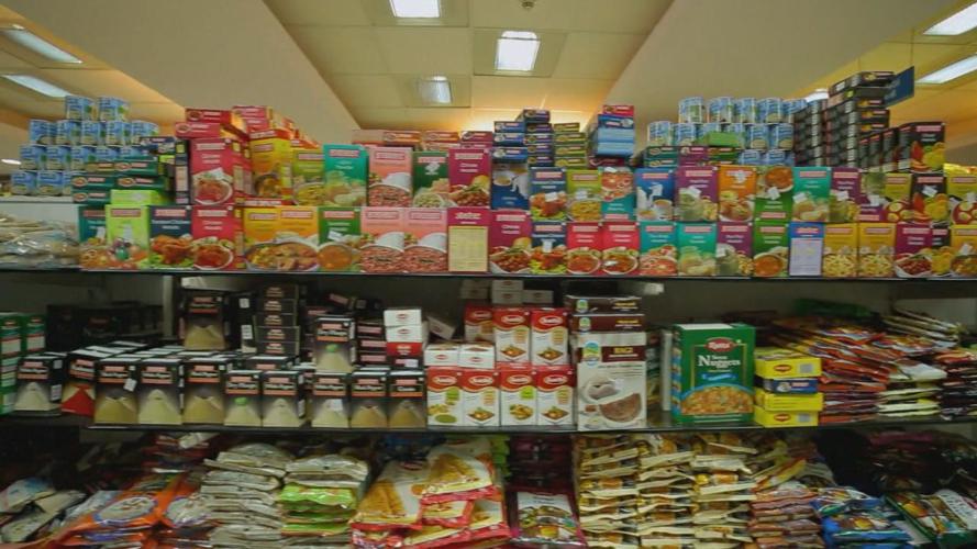 grocery aisle shelf full of packaged foods